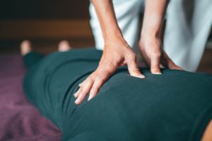 person getting massage to heal from surgery holistically