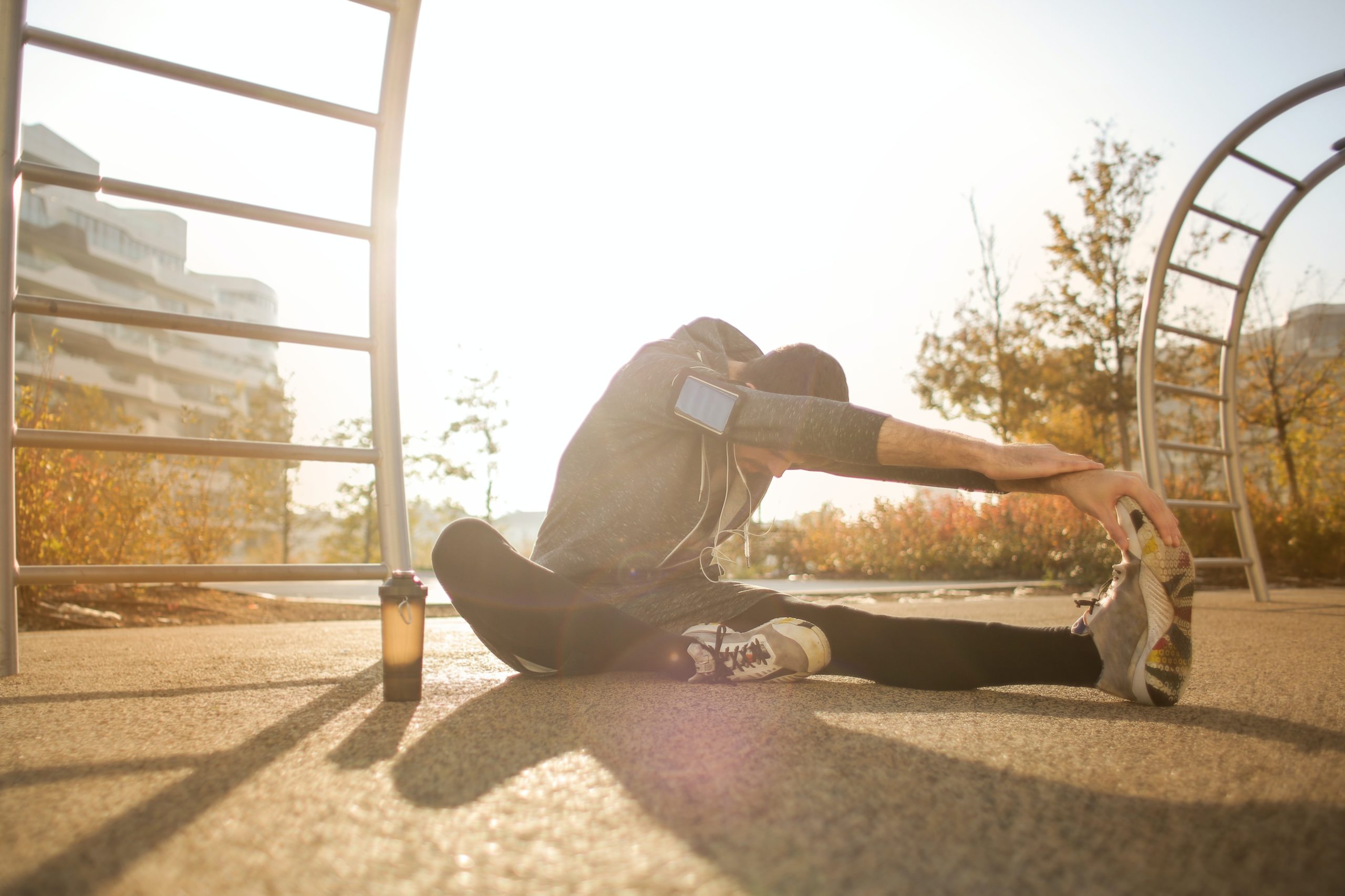 man stretching to heal from surgery